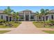 Beautiful single-story home featuring a tiled roof, symmetrical landscaping, and an inviting front entryway at 3212 Signet Ct, Sarasota, FL 34240