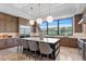 Kitchen featuring a large island with seating, custom cabinets, and stainless steel appliances at 3212 Signet Ct, Sarasota, FL 34240