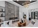 Sophisticated living room with stone fireplace, stylish light fixture, and comfortable seating arrangement at 3212 Signet Ct, Sarasota, FL 34240
