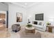 Open-concept living room features high ceilings and modern decor, with views of the kitchen at 3212 Signet Ct, Sarasota, FL 34240