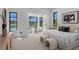 Bright main bedroom featuring large windows with views of the pool and outdoor living area at 3212 Signet Ct, Sarasota, FL 34240
