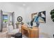 Bright home office with modern desk, stylish furniture, and French doors leading to the outdoor space at 3212 Signet Ct, Sarasota, FL 34240