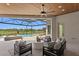 Covered outdoor patio features a seating area, dining table, and pool with golf course views at 3212 Signet Ct, Sarasota, FL 34240