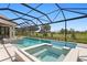 Backyard pool and spa offers beautiful landscaping and a screened enclosure to keep bugs away at 3212 Signet Ct, Sarasota, FL 34240