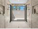 Shower with dual shower heads and a large black frame window at 3212 Signet Ct, Sarasota, FL 34240