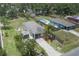 Aerial view of the property highlighting the home, driveway, yard, and pool at 3411 15Th E St, Ellenton, FL 34222