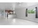Open-concept living room featuring tile flooring and a seamless transition to the kitchen area at 3411 15Th E St, Ellenton, FL 34222