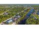 An aerial view showcasing the waterfront community, serene canals, and lush greenery at 3415 Knox Ter, Port Charlotte, FL 33948