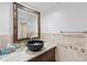 Modern bathroom featuring marble countertops, beautiful bowl sink, and stylish vanity at 3415 Knox Ter, Port Charlotte, FL 33948