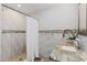 Beautifully renovated bathroom with modern finishes, a walk-in shower, and stylish tile accents at 3415 Knox Ter, Port Charlotte, FL 33948
