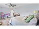 Comfortable bedroom with bright walls, wood floors, closet, and a ceiling fan at 3415 Knox Ter, Port Charlotte, FL 33948