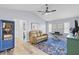 Spacious living room featuring a vaulted ceiling, hardwood floors, and bright, airy atmosphere at 3415 Knox Ter, Port Charlotte, FL 33948