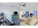 Comfortable living space with wood floors, tv, a vaulted ceiling with ceiling fan and workspace at 3415 Knox Ter, Port Charlotte, FL 33948