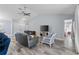 Spacious living room with vaulted ceilings, wood tile flooring, and open floor plan at 3415 Knox Ter, Port Charlotte, FL 33948