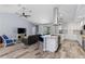 Bright living space with modern kitchen, comfortable seating, and access to outdoor area at 3415 Knox Ter, Port Charlotte, FL 33948