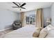 Bright main bedroom boasting wood flooring, natural light, and slider leading to outdoor patio at 3415 Knox Ter, Port Charlotte, FL 33948