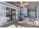 Covered patio with seating, dining table, and access to the pool and spa at 3415 Knox Ter, Port Charlotte, FL 33948