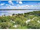 A picturesque aerial view of waterfront homes amongst tropical plants at 3601 Riverview Blvd, Bradenton, FL 34205