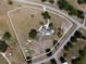 Aerial view of the property highlighting the residence, surrounded by lush landscapes and mature trees at 3810 Hidden River Rd, Sarasota, FL 34240