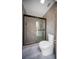 Bathroom with tiled shower and toilet at 3810 Hidden River Rd, Sarasota, FL 34240