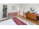 Stylish bedroom features hardwood floors, modern furniture, and calming decor at 3810 Hidden River Rd, Sarasota, FL 34240
