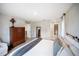 Bright bedroom with neutral colors, chest, and ensuite bathroom access at 3810 Hidden River Rd, Sarasota, FL 34240