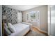 Comfortable bedroom with bright natural light and a peaceful setting at 3810 Hidden River Rd, Sarasota, FL 34240