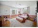 Bright pink bedroom with great natural light and a comfortable bed at 3810 Hidden River Rd, Sarasota, FL 34240