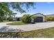 Charming single-story home featuring a circular driveway and an attached two-car garage at 3810 Hidden River Rd, Sarasota, FL 34240