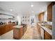 Well-equipped kitchen with an island cooktop, ample storage, and a seamless flow to the dining area at 3810 Hidden River Rd, Sarasota, FL 34240