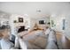 Inviting living room with a fireplace, plush sectional, and an open layout design at 3810 Hidden River Rd, Sarasota, FL 34240
