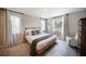 Beautiful bedroom with large windows, natural light, and tasteful decor at 3810 Hidden River Rd, Sarasota, FL 34240
