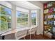 Bright office with a large window providing abundant natural light and built in shelves for storage at 3810 Hidden River Rd, Sarasota, FL 34240