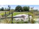 Fenced paddock on a horse property with lush greenery, providing ample space for outdoor activities and animal keeping at 3810 Hidden River Rd, Sarasota, FL 34240