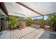 Cozy patio featuring a modern hot tub, stylish rug, and lush potted plants for a relaxing outdoor experience at 3810 Hidden River Rd, Sarasota, FL 34240