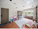 Bright, spacious playroom with large windows and play furniture at 3810 Hidden River Rd, Sarasota, FL 34240