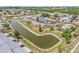 Aerial view of the home showing its backyard scenic pond view and surrounding neighborhood at 3901 41St W St, Bradenton, FL 34205