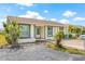 Charming single-story home with well-maintained landscaping and a cozy front entrance, under a blue sky at 3901 41St W St, Bradenton, FL 34205