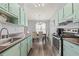 Spacious kitchen connected to dining area, featuring cabinetry and countertops at 3901 41St W St, Bradenton, FL 34205