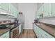Bright kitchen featuring stainless steel appliances, wood floors, and ample counter space at 3901 41St W St, Bradenton, FL 34205
