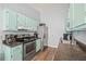 View of kitchen area, stainless steel refrigerator, stove and counters at 3901 41St W St, Bradenton, FL 34205