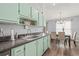 Open kitchen flowing into the dining area, featuring modern cabinetry and countertops at 3901 41St W St, Bradenton, FL 34205
