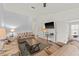Bright and airy living room with plush seating, a large TV, and plenty of space for relaxation with wood floors at 3901 41St W St, Bradenton, FL 34205
