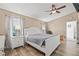 Primary bedroom with wood-look floors, fan, and natural light at 3901 41St W St, Bradenton, FL 34205