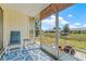 Relaxing screened patio with seating overlooking the backyard and the pond at 3901 41St W St, Bradenton, FL 34205