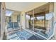 Relaxing screened patio with seating overlooking the backyard, and sliding glass door access at 3901 41St W St, Bradenton, FL 34205
