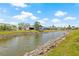 Scenic view of the pond and landscaping, backing up to the homes, enhancing the neighborhood's natural beauty at 3901 41St W St, Bradenton, FL 34205