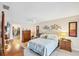 Spacious bedroom features a walk-in closet and ceiling fan at 3914 Glen Oaks Manor Dr, Sarasota, FL 34232