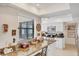 Bright kitchen featuring granite countertops, white cabinets, and stainless steel microwave at 3914 Glen Oaks Manor Dr, Sarasota, FL 34232