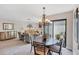 Spacious combined living and dining area featuring stylish decor and outdoor access at 3914 Glen Oaks Manor Dr, Sarasota, FL 34232